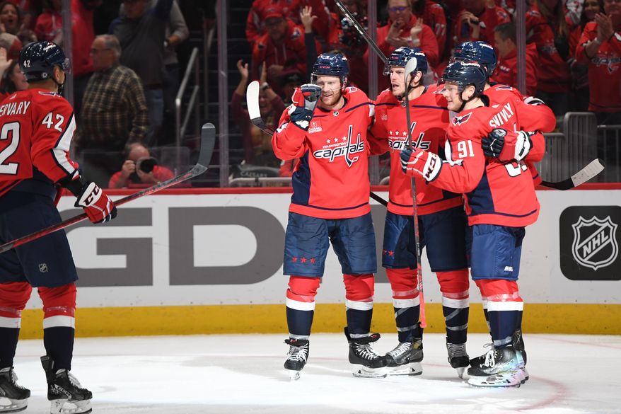 Capitals players celebrate center Nic Dowd’s (26) 3rd period goal in a game against the Los Angeles Kings at Capital One Arena in Washington D.C., October 22, 2022. (Photo by Billy Sabatini)