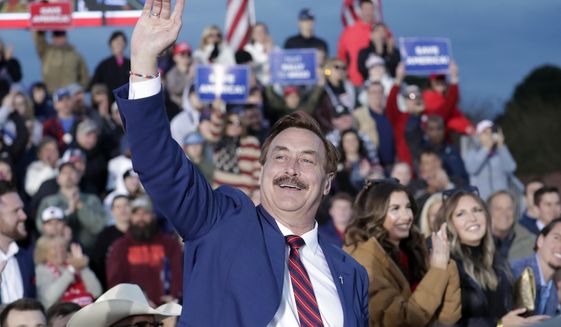 MyPillow CEO Mike Lindell waves to the crowd after he was recognized by former President Donald Trump during a rally April 9, 2022, in Selma, N.C. (AP Photo/Chris Seward, File)