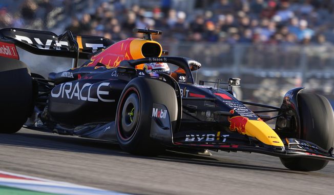 Red Bull driver Max Verstappen, of the Netherlands, heads through a turn during the second practice session for the Formula One U.S. Grand Prix auto race at Circuit of the Americas, Friday, Oct. 21, 2022, in Austin, Texas. (AP Photo/Eric Gay)