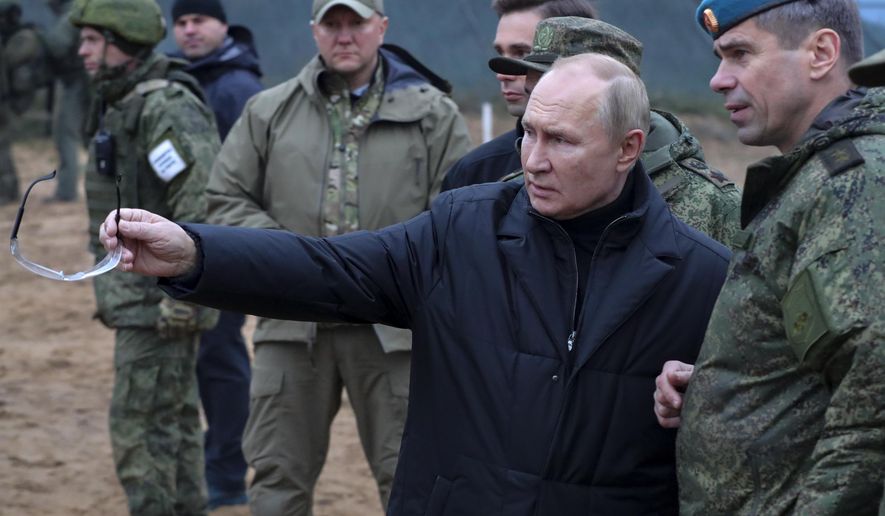 Russian President Vladimir Putin, second right, gestures as he visits with Deputy Commander of the Airborne Troops Anatoly Kontsevoy, right, a military training centre of the Western Military District for mobilised reservists in Ryazan Region, Russia, on Oct. 20, 2022. Moscow after a string of battlefield defeats and other setbacks, further cornering Russian President Vladimir Putin and setting the stage for an escalation. Ukrainian forces pressing an offensive in the south have zeroed in on Kherson, a provincial capital that has been under Russian control since the early days of the invasion. (Mikhail Klimentyev, Sputnik, Kremlin Pool Photo via AP, File)