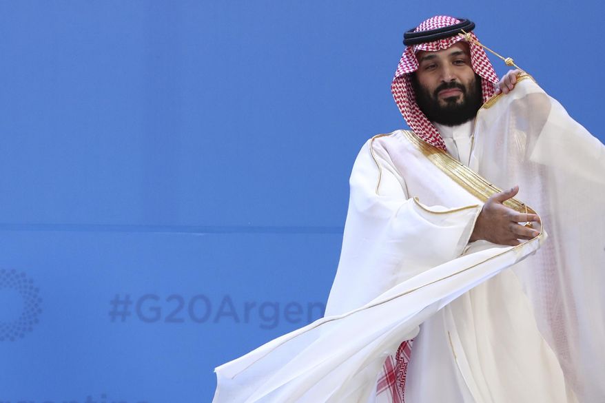Saudi Arabia&#x27;s Crown Prince Mohammed bin Salman adjusts his robe as leaders gather for the group at the G20 Leader&#x27;s Summit at the Costa Salguero Center in Buenos Aires, Argentina, Nov. 30, 2018. (AP Photo/Ricardo Mazalan, File)