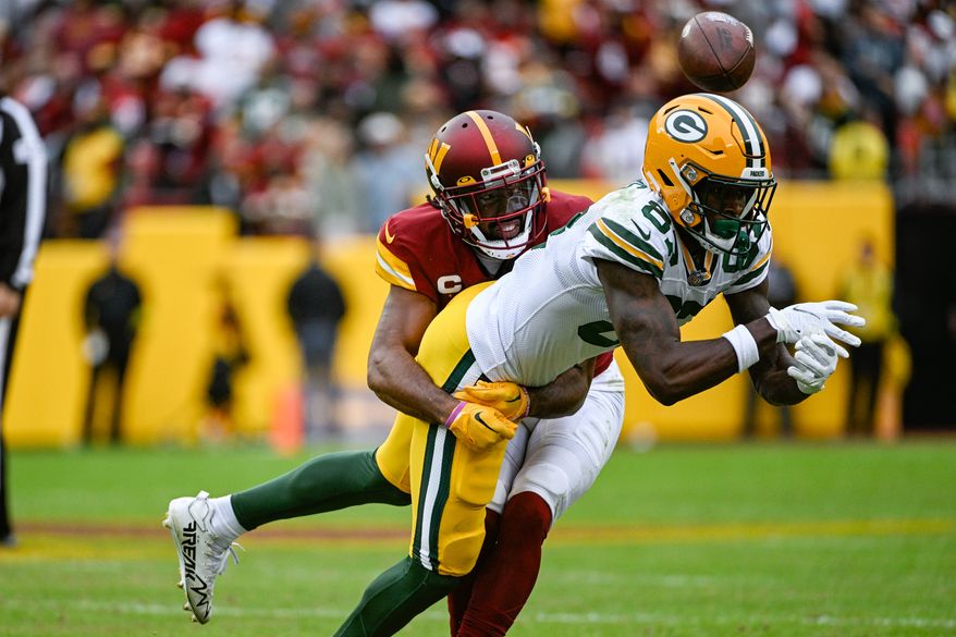Washington Commanders cornerback Kendall Fuller (29) breaks up a pass attempt to force a turnover on downs against the Green Bay Packers at FedEx Field, Landover, MD, October 23, 2022. (Photo by Brian Murphy)