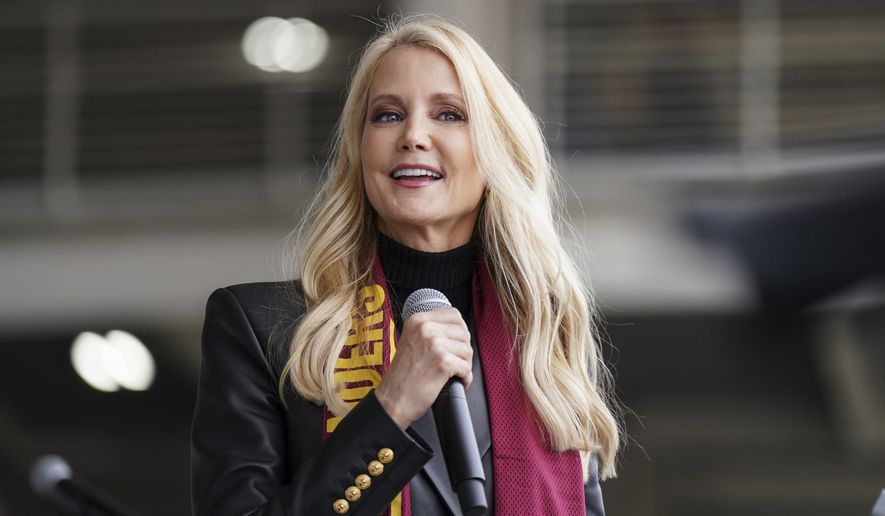 Tanya Snyder, Washington Commanders co-owner and co-CEO, speaks before an NFL football game between the Washington Commanders and the Green Bay Packers, Sunday, Oct. 23, 2022, in Landover, Md. (AP Photo/Al Drago)