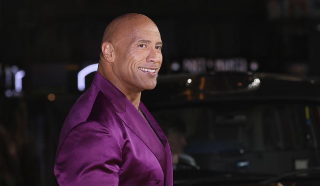 Dwayne Johnson poses for photographers upon arrival for the premiere of the film &#x27;Black Adam&#x27; on Tuesday, Oct. 18, 2022, in London. (Photo by Vianney Le Caer/Invision/AP)