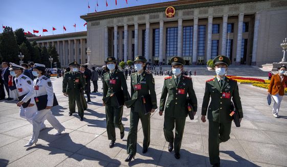 Military attendees leave after the opening ceremony of the 20th National Congress of China&#39;s ruling Communist Party at the Great Hall of the People in Beijing on Oct. 16, 2022. In a speech that used the word security 26 times, Chinese leader Xi Jinping said Beijing will &amp;quot;work faster&amp;quot; to modernize the party&#39;s military wing, the People&#39;s Liberation Army, and &amp;quot;enhance the military&#39;s strategic capabilities.&amp;quot; (AP Photo/Mark Schiefelbein, File)