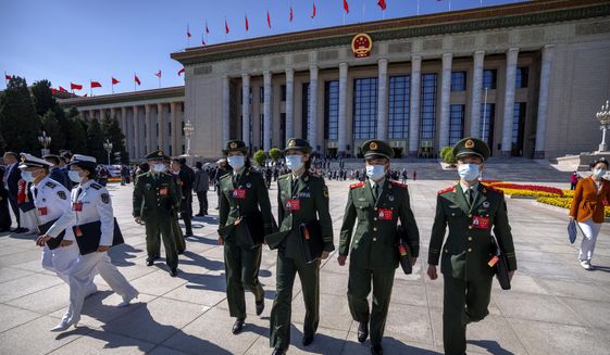 Military attendees leave after the opening ceremony of the 20th National Congress of China&#x27;s ruling Communist Party at the Great Hall of the People in Beijing on Oct. 16, 2022. In a speech that used the word security 26 times, Chinese leader Xi Jinping said Beijing will &amp;quot;work faster&amp;quot; to modernize the party&#x27;s military wing, the People&#x27;s Liberation Army, and &amp;quot;enhance the military&#x27;s strategic capabilities.&amp;quot; (AP Photo/Mark Schiefelbein, File)