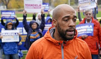 Wisconsin Democratic U.S. Senate candidate Mandela Barnes answers question outside a polling place after voting early Tuesday, Oct. 25, 2022, in Milwaukee. (AP Photo/Morry Gash)