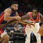 Washington Wizards forward Will Barton, right, dribbles the ball against Detroit Pistons guard Cory Joseph, left, during the first half of an NBA basketball game, Tuesday, Oct. 25, 2022, in Washington. (AP Photo/Nick Wass)
