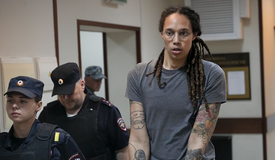 WNBA star and two-time Olympic gold medalist Brittney Griner is escorted from a courtroom after a hearing in Khimki just outside Moscow, Russia, on Aug. 4, 2022. A Russian court on Tuesday started hearing American basketball star Brittney Griner&#x27;s appeal against her nine-year prison sentence for drug possession. (AP Photo/Alexander Zemlianichenko, File)