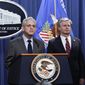 Attorney General Merrick Garland, center, flanked by Deputy Attorney General Lisa Monaco, left, and FBI Director Christopher Wray, speaks to reporters as they announce charges against two men suspected of being Chinese intelligence officers for attempting to obstruct a U.S. criminal investigation and prosecution of Chinese tech giant Huawei, at the Department of Justice in Washington, Monday, Oct. 23, 2022. (AP Photo/J. Scott Applewhite)