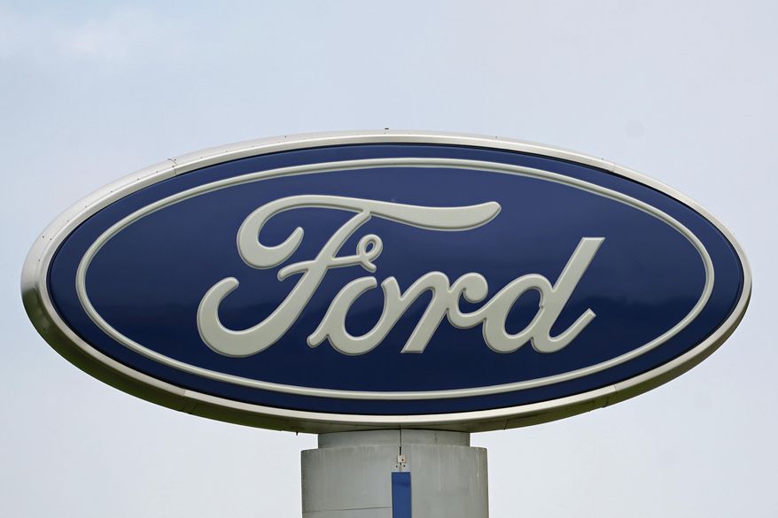 A Ford logo is seen on signage at Country Ford in Graham, N.C., on July 27, 2021. Ford is pulling out of its investment in Argo AI, an autonomous vehicle company that it jointly owns mainly with Volkswagen. The company said Wednesday, Oct. 26, 2022, in its third-quarter earnings materials that it is switching investment priorities from fully autonomous vehicles to advanced driver assist systems. (AP Photo/Gerry Broome, File)