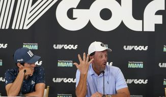 Phil Mickelson, right, speaks during a news conference for the LIV Golf Team Championship at Trump National Doral Golf Club, Wednesday, Oct. 26, 2022, in Doral, Fla. At left is Joaquinn Niemann. (AP Photo/Lynne Sladky)