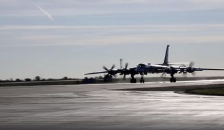 In this handout photo taken from video released by Russian Defense Ministry Press Service on Wednesday, Oct. 26, 2022, a Russian Tu-95 taxies at a base as part of Russia&#x27;s nuclear drills. (Russian Defense Ministry Press Service via AP)