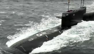 In this handout photo taken from video released by Russian Defense Ministry Press Service on Wednesday, Oct. 26, 2022, the Tula nuclear submarine of the Russian navy is on a mission to conduct a practice launch of an intercontinental ballistic missile as part of drills of the country&#39;s nuclear forces. Russian President Vladimir Putin has monitored drills of the country&#39;s strategic nuclear forces involving multiple practice launches of ballistic and cruise missiles. The Kremlin said in a statement that all the test-fired missiles reached their designated targets. (Russian Defense Ministry Press Service via AP)