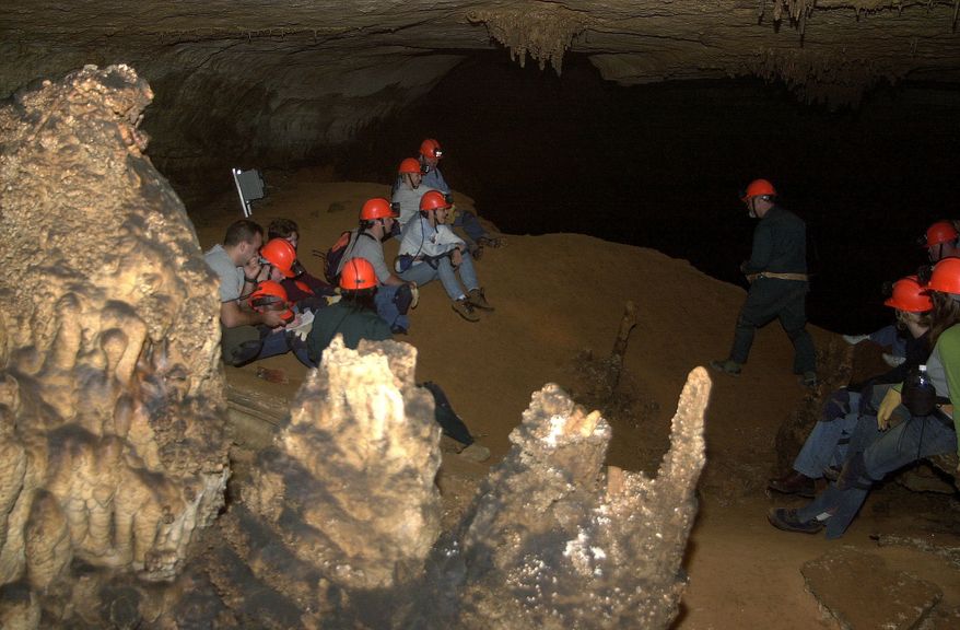 A group rests hundreds of feet underground at Blanchard Springs Cavern in the Ozark Mountains, Friday, Aug. 8, 2003, in Blanchard Springs, Ark. Small groups are outfitted with miner&#x27;s helmets, head lamps, heavy-duty gloves and kneepads for the muddy excursions, paying between $20 and $80 for the four- to six-hour guided tour. (AP Photo/Mike Wintroath) **FILE**