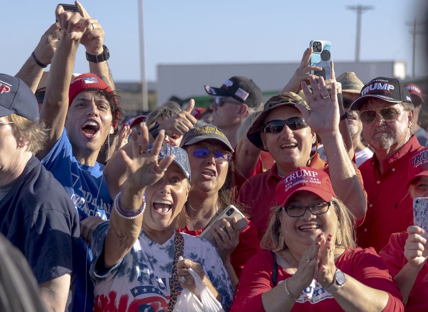 People react with delight during a rally featuring former President Donald Trump, My Pillow CEO Mike Lindell and other crowd favorites on Saturday, Oct. 22, 2022, in Robstown, Texas. (AP Photo/Nick Wagner)