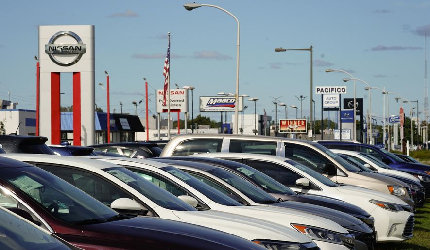 Cars for sale line the road at a used auto dealership in Philadelphia, Thursday, Sept. 29, 2022. The prices of new and used vehicles in the United States have begun inching down from their eye-watering record highs as more vehicles have become gradually available at dealerships. (AP Photo/Matt Rourke, File)