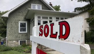 A &quot;sold&quot; sign is posted outside a single family home in a residential neighborhood, in Glenside, Pa., Wednesday, Aug. 4, 2021.  Mortgage buyer Freddie Mac reported Thursday, Oct. 27, 2022,  that the average on the key 30-year rate jumped to 7.08% from 6.94% last week.(AP Photo/Matt Rourke, File)
