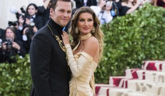 FILE - Tom Brady and Gisele Bundchen attend The Metropolitan Museum of Art&#39;s Costume Institute benefit gala on May 7, 2018, in New York. The couple announced Friday they have finalized their divorce, ending their 13-year marriage. (Photo by Charles Sykes/Invision/AP, File)