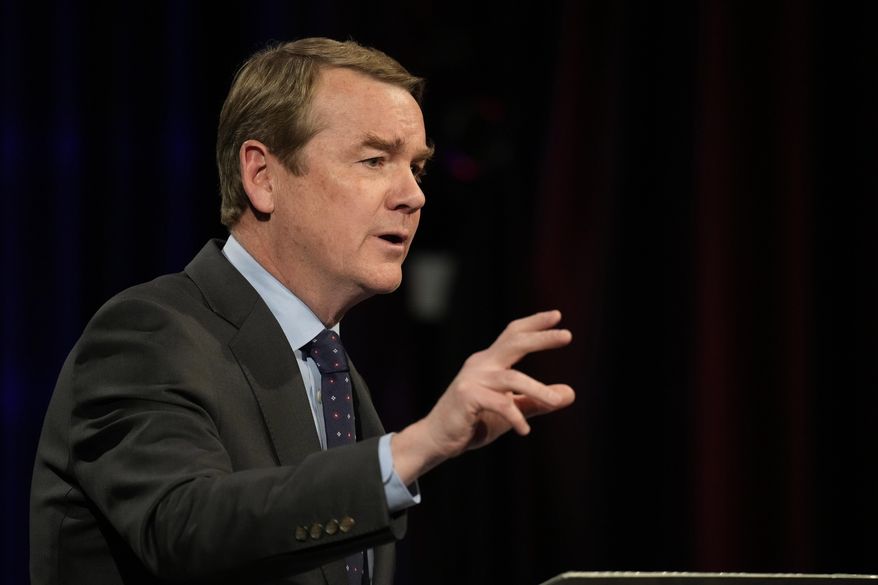 Democratic U.S. Sen. Michael Bennet makes a point during a debate with Republican challenger Joe O'Dea, Friday, Oct. 28, 2022, on the campus of Colorado State University in Fort Collins, Colo. (AP Photo/David Zalubowski)