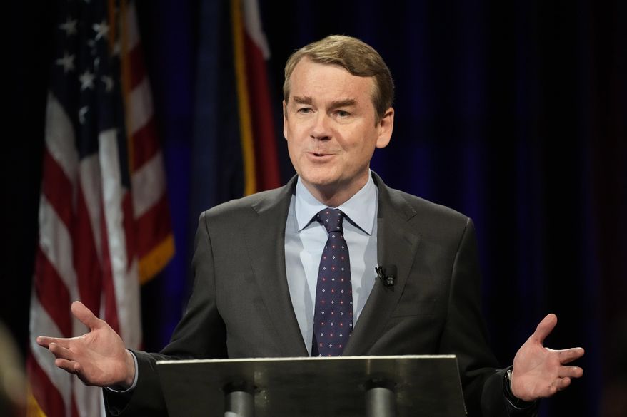 Democratic U.S. Sen. Michael Bennet responds to a question during a debate with Republican challenger Joe O'Dea, Friday, Oct. 28, 2022, on the campus of Colorado State University in Fort Collins, Colo. (AP Photo/David Zalubowski)