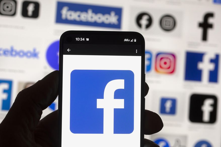 The Facebook logo is seen on a cell phone on Oct. 14, 2022, in Boston. (AP Photo/Michael Dwyer, File)