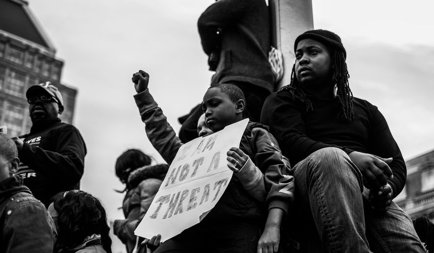 Residents of Baltimore gather during the community’s response to the 2015 in-custody death of Freddie Gray. The photo is part of a collection called “the Impact of Images” collection curated by Lead With Love, in collaboration with the studio and production company behind the film “Till.”  (Devin Allen via AP)