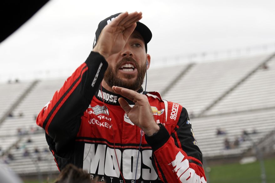 Ross Chastain gestures as he talks to a crew member during practice for the NASCAR auto race at Martinsville Speedway, Saturday, Oct. 29, 2022, in Martinsville, Va. (AP Photo/Chuck Burton) **FILE**