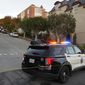 A police car blocks the street below the home of House Speaker Nancy Pelosi and her husband Paul Pelosi in San Francisco, Friday, Oct. 28, 2022. Paul Pelosi, was attacked and severely beaten by an assailant with a hammer who broke into their San Francisco home early Friday, according to people familiar with the investigation. (AP Photo/Eric Risberg)