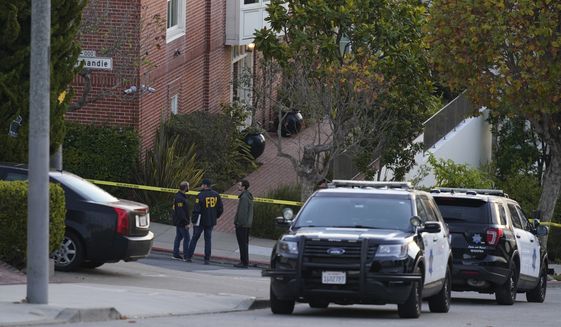 A pair of FBI agents work outside the home of House Speaker Nancy Pelosi and her husband Paul Pelosi in San Francisco, Friday, Oct. 28, 2022. Paul Pelosi, was attacked and severely beaten by an assailant with a hammer who broke into their San Francisco home early Friday, according to people familiar with the investigation. (AP Photo/Eric Risberg)