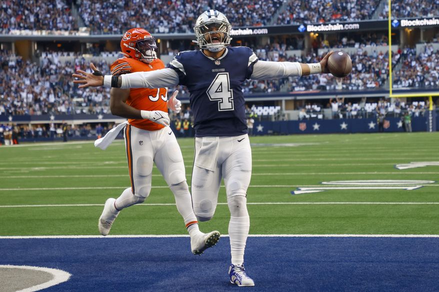 Dallas Cowboys&#x27; Dak Prescott runs for a touchdown during the first half of an NFL football game against the Chicago Bears Sunday, Oct. 30, 2022, in Arlington, Texas. (AP Photo/Michael Ainsworth)