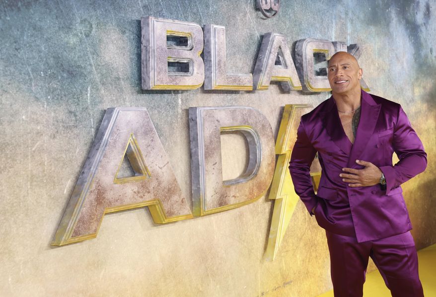 Dwayne Johnson poses for photographers upon arrival for the premiere of the film &#x27;Black Adam&#x27; on Tuesday, Oct. 18, 2022, in London. (Photo by Vianney Le Caer/Invision/AP)
