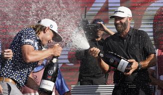 Cameron Smith, left, and Dustin Johnson, right,  celebrate after the final round of the LIV Golf Team Championship at Trump National Doral Golf Club, Sunday, Oct. 30, 2022, in Doral, Fla. Johnson&#39;s 4 Aces GC team won the team championship. (AP Photo/Lynne Sladky) **FILE**