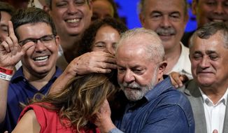 Former Brazilian President Luiz Inacio Lula da Silva embraces his wife Rosangela, after defeating incumbent Jair Bolsonaro in a presidential run-off to become the country&#39;s next president, in Sao Paulo, Brazil, Sunday, Oct. 30, 2022. (AP Photo/Andre Penner)