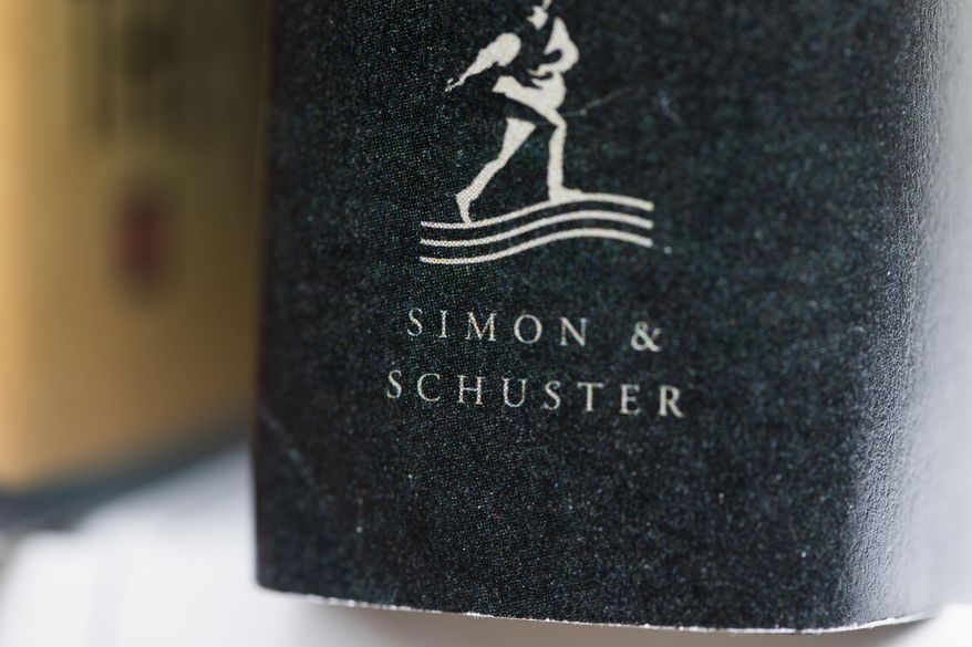 A book published by Simon &amp; Schuster is displayed on Saturday, July 30, 2022, in Tigard, Ore. On Monday, Oct. 31, 2022, a federal judge blocked Penguin Random House&#x27;s proposed purchase of Simon &amp; Schuster. (AP Photo/Jenny Kane, File) **FILE**
