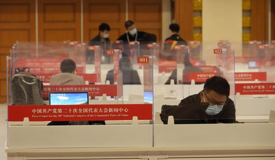 Chinese journalists work at a press center for the 20th Party Congress in Beijing on  Oct. 20, 2022. China&#39;s ruling Communist Party has long relied on a critically important and secretive internal reference system to learn about issues considered too sensitive for the public to know. But as Chinese leader Xi Jinping tightens censorship and consolidates his rule, Chinese academics and journalists say even this internal system is struggling to give frank assessments. (AP Photo/Ng Han Guan)