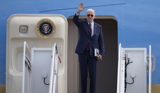 President Joe Biden waves as he boards Air Force One at Andrews Air Force Base, Md., Tuesday, Nov. 1, 2022, en route to Florida. (AP Photo/Jess Rapfogel)