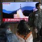 A South Korean army soldier passes by a TV screen showing a file image of North Korea&#39;s missile launch during a news program at the Seoul Railway Station in Seoul, South Korea, Wednesday, Nov. 2, 2022. South Korea says it has issued an air raid alert for residents on an island off its eastern coast after North Korea fired a few missiles toward the sea. (AP Photo/Ahn Young-joon)