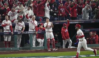Philadelphia Phillies&#39; Bryce Harper celebrates his two-run home run during the first inning in Game 3 of baseball&#39;s World Series between the Houston Astros and the Philadelphia Phillies on Tuesday, Nov. 1, 2022, in Philadelphia. (AP Photo/Matt Rourke)