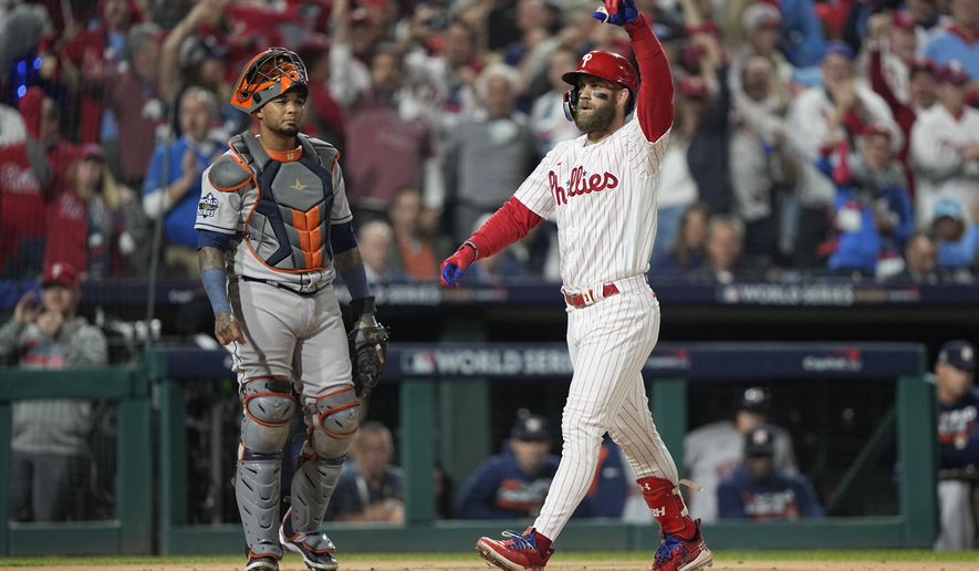 Philadelphia Phillies&#39; Bryce Harper celebrates his two-run home run during the first inning in Game 3 of baseball&#39;s World Series between the Houston Astros and the Philadelphia Phillies on Tuesday, Nov. 1, 2022, in Philadelphia. (AP Photo/David J. Phillip)