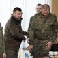 Denis Pushilin, leader of self-proclaimed Donetsk People’s Republic, second left, meets with liberated soldiers during the exchange of servicemen of the Donetsk People’s Republic who were imprisoned and the Lugansk People’s Republic, in Amvrosiivka, Donetsk People’s Republic, eastern Ukraine, Tuesday, Nov. 1, 2022. Russia and Ukraine on Saturday made an exchange of prisoners, which took place according to the formula &amp;quot;50 to 50&amp;quot;. (AP Photo/Alexei Alexandrov)
