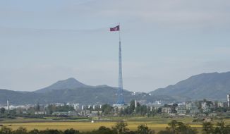 A North Korean flag flutters in the wind near the border villages of Panmunjom in Paju, South Korea on Oct. 4, 2022. South Korea says Friday, Oct. 28, 2022, North Korea has fired a ballistic missile toward its eastern waters. (AP Photo/Ahn Young-joon, File)