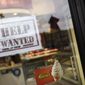 A help wanted sign in a storefront, Tuesday, Nov. 1, 2022, in Bedford, N.Y. The Federal Reserve may reach a turning point this week as it announces what&#39;s expected to be another substantial three-quarter-point hike in its key interest rate. The Fed&#39;s hikes have already led to much costlier borrowing rates, ranging from mortgages to auto and business loans.   (AP Photo/Julia Nikhinson)
