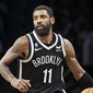 Brooklyn Nets guard Kyrie Irving (11) dribbles against the Chicago Bulls during the second half of an NBA basketball game Tuesday, Nov. 1, 2022, in New York. (AP Photo/Jessie Alcheh)