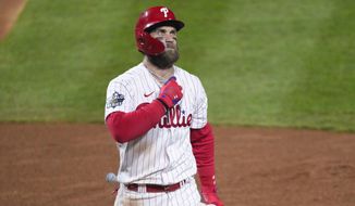 Philadelphia Phillies&#39; Bryce Harper walks to the dugout after striking out during the fourth inning in Game 4 of baseball&#39;s World Series between the Houston Astros and the Philadelphia Phillies on Wednesday, Nov. 2, 2022, in Philadelphia. (AP Photo/Chris Szagola) **FILE**