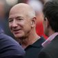 FILE - Amazon founder Jeff Bezos is seen on the sidelines before the start of an NFL football game on Sept. 15, 2022, in Kansas City, Mo. A former housekeeper for Bezos says she and other employees suffered unsafe working conditions that included being forced to climb out a laundry room window to get to a bathroom. In a lawsuit filed in Seattle this week, a longtime housekeeper claims she was discriminated and retaliated against when she complained about a lack of rest breaks or an area where staff could eat. (AP Photo/Charlie Riedel, File)