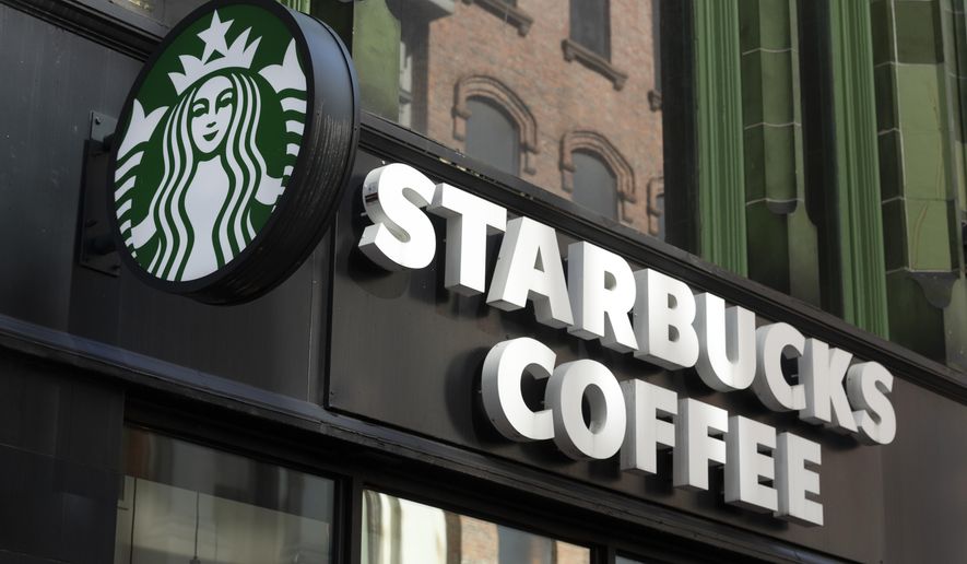 The Starbucks logo is seen on a storefront, Friday, Oct. 14, 2022, in Boston Starbucks reports quarterly financial results Thursday, Nov. 3, 2022.  (AP Photo/Michael Dwyer, File) **FILE**