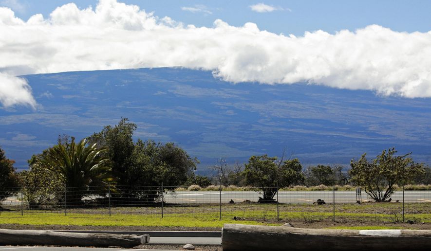 Mauna Loa is seen from the Gilbert Kahele Recreation Area off Saddle Road on the Big Island of Hawaii on Oct. 27, 2022. The ground is shaking and swelling at Mauna Loa, the largest active volcano in the world, indicating that it could erupt. Scientists say they don&#39;t expect that to happen right away but officials on the Big Island are telling residents to be prepared in case it does erupt soon. (AP Photo/Megan Moseley)