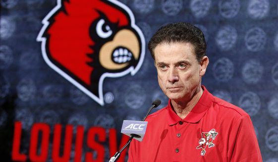 Louisville NCAA college basketball head coach Rick Pitino answers a question during the Atlantic Coast Conference men&#39;s media day in Charlotte, N.C., Oct. 26, 2016. An independent panel has fined Louisville $5,000 and placed the men’s basketball program on two years probation, but sparing the school major penalties from NCAA allegations leveled in the aftermath of a federal investigation of corruption in college basketball. The Independent Accountability Resolution Process (IARP) also declined to penalize former Cardinals coach Rick Pitino, whom the NCAA initially cited for failure to promote an atmosphere of compliance. (AP Photo/Bob Leverone, File)