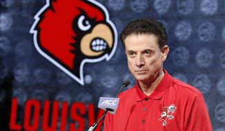 Louisville NCAA college basketball head coach Rick Pitino answers a question during the Atlantic Coast Conference men&#x27;s media day in Charlotte, N.C., Oct. 26, 2016. An independent panel has fined Louisville $5,000 and placed the men’s basketball program on two years probation, but sparing the school major penalties from NCAA allegations leveled in the aftermath of a federal investigation of corruption in college basketball. The Independent Accountability Resolution Process (IARP) also declined to penalize former Cardinals coach Rick Pitino, whom the NCAA initially cited for failure to promote an atmosphere of compliance. (AP Photo/Bob Leverone, File)